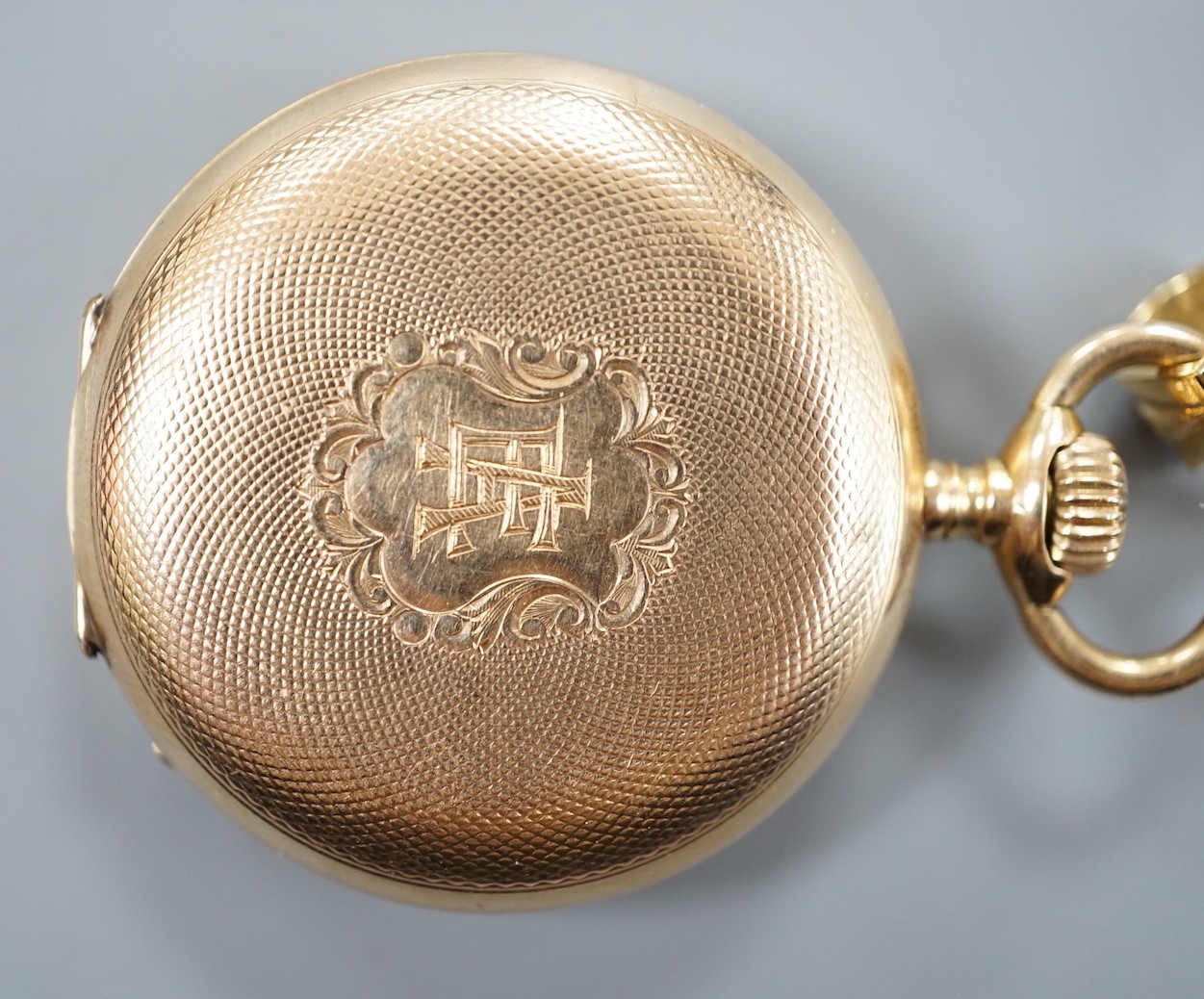 An early 20th century engine turned 14k yellow metal hunter keyless fob watch, with engraved monogram, dial inscribed Borel, Neuchatel, case diameter 36mm, gross weight 34.5 grams.